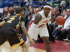 Sudbury Five guard Braylon Rayson (2) prepares to make a pass while London Lightning guard Xavier Moon (2) defends during NBLC action at Sudbury Community Arena in Sudbury, Ontario on Saturday, March 7, 2020.