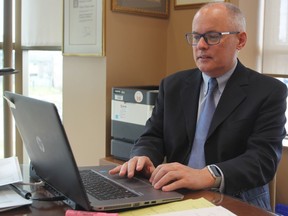Dr. Kieran Moore, medical officer of health for Kingston, Frontenac and Lennox and Addington Public Health, in his office in Kingston, Ont., on Monday, March 30, 2020. Steph Crosier/The Whig-Standard/Postmedia Network