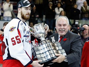 CHL Commissioner David Branch presents the CHL Memorial Cup to Harry Young #55 of the Windsor Spitfires during the 2009 Mastercard Memorial Cup Final at the Rimouski Colisee on May 24, 2009 in Rimouski, Quebec, Canada.