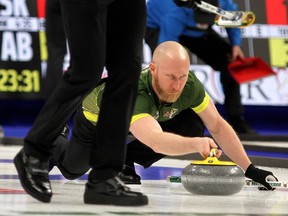 Northern Ontario's Brad Jacobs takes a shot as Ryan Harnden sweeps at the 2020 Tim Hortons Brier in Kingston on Saturday March 7, 2020. Northern Ontario  won the tie breaker game 8-4 over Ontario Ian MacAlpine/Kingston Whig-Standard/ Postmedia Network