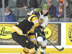 Simon Rose tries to get the puck past Kingston Frontenacs defenceman Jakob Brahaney during Ontario Hockey League action.
Ian MacAlpine/Postmedia Network