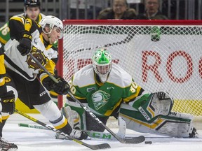 Liam Van Loon of the Hamilton Bulldogs tries a backhander against London Knights goalie Brett Brochu at Budweiser Gardens in London, Ont., on Friday, Jan. 24, 2020.  Mike Hensen/The London Free Press/Postmedia Network