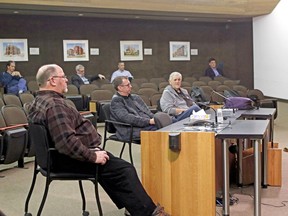 Councillors Chris Mayne, left, Mac Bain and Bill Vrebosch practise social distancing during an emergency council meeting, March 20. Nugget File Photo