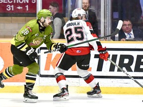Luke Moncada of the North Bay Battalion battles Daylon Groulx of the visiting Ottawa 67's, March 8. It would be the last game for the Troops before the 2019-20 season was cancelled due to the COVID-19 pandemic. Sean Ryan Photo