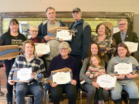 The 2020 Owen Sound Arts and Cultural Award recipients with their awards at the Georgian Bay Centre for the Arts on Sunday, March 1, 2020 in Owen Sound, Ont. Back row, from left are: Trish Nadjiwon Meekins and Virginia Gail Smith of the Wiidosendiwag + Walking Together + Marchons Ensemble Tour, winner of the Cultural Heritage Award; Wendall and Sidney Nadjiwon, sons of the late Wilmer Nadjiwon who won a lifetime achievement award; and Alanna Leffley and Stuart Reid of the Community Foundation Grey Bruce, which won the Cultural Catalyst award. Front row, from left, are: Emerging Artist award winner Kevin Griffin, Maryann Thomas of the Owen Sound ArtWalk, which won the Most Promising New Event award; Angola Murdoch and her daughter Luella Mac Mahon of Lookup Theatre, Outstanding Group award; and Stephanie Fowler, Outstanding Individual award. Absent from the photo were representatives from Scenic City Film Festival, Outstanding Event award. Rob Gowan/The Owen Sound Sun Times/Postmedia Network