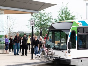 Region residents wait for a bus. The commission aiming for a system serving all those in and around Edmonton is slowly making gains on the path to operating.