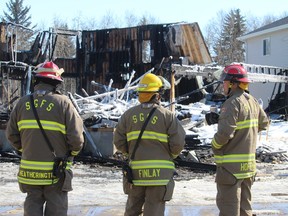 Emergency services tend to the aftermath of a fire that broke out on Meadowpark Gate in Spruce Grove Saturday. No one was hurt in the blaze that destroyed the not-yet-inhabited home and a neighbouring structure was also damaged. The cause remains under investigation. More on Page XX.

Evan J. Pretzer