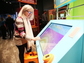 Miroslava Tripaliouk checks out Science North's new exhibition, The Science of Guinness World Records, at the science centre in Sudbury, Ont. on Friday March 6, 2020. This travelling exhibition will be at Science North until September 7, 2020, before embarking on a five-year tour of science centres and museums across North America.