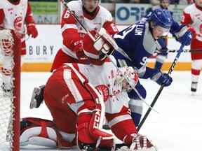 Landon McCallum, right, of the Sudbury Wolves, looks for a rebound in front of goalie Nick Malik, of the Soo Greyhounds, during OHL action at the Sudbury Community Arena in Sudbury, Ont. on Friday March 6, 2020. John Lappa/Sudbury Star/Postmedia Network