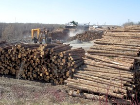 Wood ready for processing can be seen in the yard at EACOM Timber Corporation's Timmins mill in this file photo.