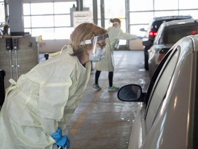 Drive-through COVID-19 tests are performed by health care workers in Sherwood Park. Supplied Image/Alberta Health Services