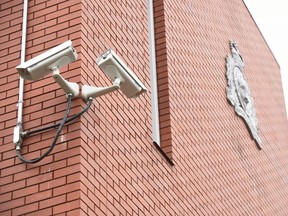 Video surveillance cameras outside the Grande Prairie RCMP detachment on Tuesday October 25, 2016 in Grande Prairie, Alta.