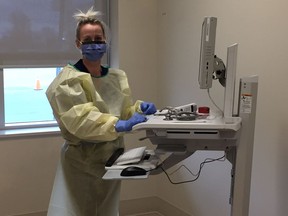 A nurse, in personal protective equipment works at the Cornwall COVID-19 assessment centre  in Cornwall, Ont. Joshua Santos/Cornwall Standard-Freeholder/Postmedia Network