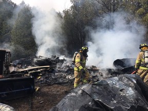 Firefighters assess the damage after a fire at a seasonal home on Leacock Road on Tuesday, Apr. 28, 2020. Submitted photo.