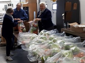 The Huron County Food Bank Distribution Centre's (HCFBDC) and United Way Perth-Huron (UWPH) teamed up through UWPH's COVID-19 Urgent Needs Fund in April to raise funds for bulk purchases to supply food banks across Perth and Huron. Pictured are volunteers working at the Huron County Food Bank Distribution Centre.