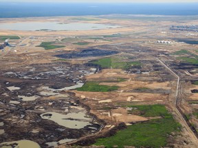 An aerial view of Kearl Oilsands Project which is owned by Imperial Oil and ExxonMobile Canada north of Fort McMurray, Alta. on June 18, 2013. Ryan Jackson/Postmedia Network