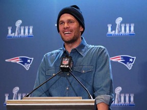 Tom Brady speaks to the media at the World Congress Center in Atlanta, Georgia. TIMOTHY A. CLARY/AFP via Getty Images