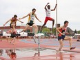 Athletes compete in the open boys 2,000 metre steeplechase event at the OFSAA Track and Field championship at the Laurentian University track in Sudbury  on Friday, June 3, 2011. JOHN LAPPA/THE SUDBURY STAR/POSTMEDIA NETWORK