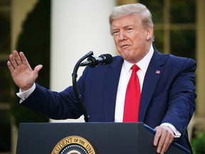 U.S. President Donald Trump takes questions from reporters during a news conference on COVID-19 in the Rose Garden of the White House on April 27.