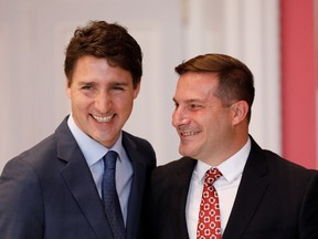 Marco Mendicino poses with Canada's Prime Minister Justin Trudeau after being sworn-in as Minister of Immigration, Refugees and Citizenship during the presentation of Trudeau's new cabinet, at Rideau Hall in Ottawa, Ontario, Canada November 20, 2019. REUTERS/Blair Gable ORG XMIT: MEX321