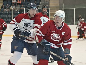 Randy Rowe (front) is shown in action during an annual Hockey Night in Brantford fundraising hockey game.