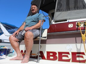 Dave Wilson of New Hamburg, Ont., spends Saturday at the McDonald Turkey Point Marina preparing his boat, Wilabee, for the water. Michelle Ruby
