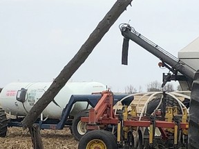 Melfort Fire was called last week to help a farmer stuck in a tractor/air seeder unit with a downed power line on top. Photo submitted.