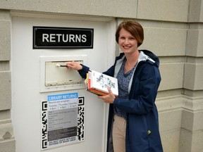 Systems librarian Krista Robinson returns some books to the Stratford Public Library. (Galen Simmons/Beacon Herald file photo)