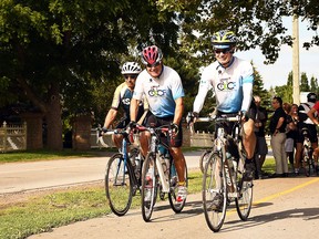 Joseph Sebben, Randy Perdu and Rand MacIntosh ride their bicycles along Phase 1 of the Round the River Recreational Trail along Grand Avenue West in Chatham in August 2019. (Tom Morrison/Postmedia)