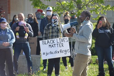 Roby Joseph, originally from Haiti, addresses a gathering outside the Sudbury Courthouse on Sunday to protest racial injustice. Joseph has called Sudbury home for six years.