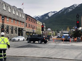 A motion to allow only pedestrian traffic along the 100 and 200 block of Banff Avenue from June 5 to Sept. 11 passed in 6-1 vote during a town council meeting on May 25. Under physical distancing rules, businesses along the avenue can now move seating and service past their existing space and outdoors or onto the sidewalk is a key part of the plan for Banff Avenue. (Pictured) New road resurfacing underway on May 28. Photo credit Marie Conboy/ Postmedia.