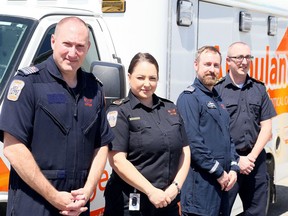 Ornge paramedics Andrew Whittemore (left), Beth Hansen and Matthew Laverty are working out of the Chatham-Kent EMS headquarters in Chatham. They're shown with Chatham-Kent EMS general manager Donald MacLellan (far right). Mark Malone/Postmedia Network