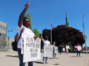 Simone Tennant stands with others Monday outside Sarnia City Hall in support of Black Lives Matter demonstrations being held around the world.