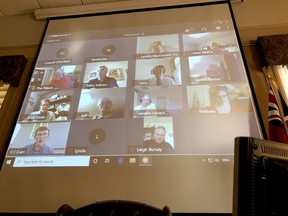 Tuesday's virtual meeting of Brockville city council is seen on a screen behind the empty mayor's desk in the main council chamber. (RONALD ZAJAC/The Recorder and Times)