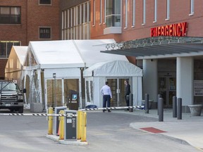 A tent was erected at the emergency entrance of St. Thomas Elgin General Hospital in early April to create more space for patients entering the hospital during the COVID-19 pandemic. A Toronto-area epidemiologist says "luck" played a role in the low case count in the Southwestern public health area. (Derek Ruttan, Postmedia Network)