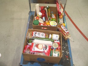 It's not quite a finished product, but these are two of the  1,500 grocery hampers being packed at the Benson Centre, and to be delivered to seniors in Cornwall and across the region.Photo on Tuesday, May 12, 2020, in Cornwall, Ont. Todd Hambleton/Cornwall Standard-Freeholder/Postmedia Network