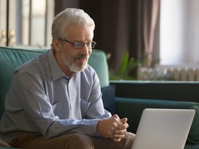 Man looking at laptop screen