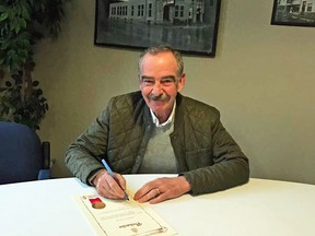 Mayor Irvine Ferris signing the proclamation Friday. (supplied photo)