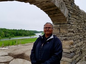 Saugeen First Nation member Jennifer Kewageshig stood May 31 at an archway leading to the amphitheatre which is being rebuilt as part of a rejuvenation of the site. (Scott Dunn/The Sun Times/Postmedia Network)