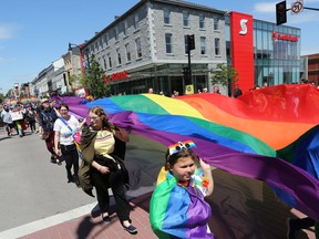 More than 900 people walked down a crowd-lined Princess Street sporting rainbow clothes, face paint, flags and more during the Kingston Pride Parade on June 15, 2019.