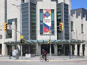 A cyclist rides through the otherwise barren corner of Union Street and University Avenue. (Ian MacAlpine/The Whig-Standard)