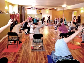 A group of students in a Stay on your feet chair yoga class. 
Supplied Photo