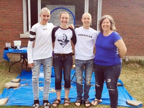 Hyping up haircuts for her twin brothers provided a boost for Ruby Pilatzke's JDRF House ParT1D for a Cure fundraiser for diabetes research. Posing for a photo after the head shaving on May 7 members of the Pilatzke family (from left) Ryan, Ruby, Kasey and mom Julie.