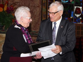 Glenna Mackenzie, chairwoman of the Carefor Anniversary Committee, shares a moment with Pembroke Mayor Mike LeMay after he read the declaration of Carefor Week in the city in early March during the launch of the public awareness campaign for the Carefor 100th anniversary. The committee has postponed all planned activities, including an anniversary banquet, due to COVID-19.