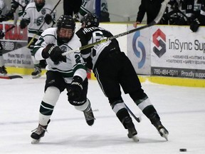 PAC Saints forward Xander Schulte steps around a check from Sherwood Park Flyers Taryn Hutchings during Alberta Major Bantam Hockey league action at Grant Fuhr Arena in Spruce Grove on Monday, Nov. 26, 2018. Sherwood Park won 6-2. Josh Aldrich/Reporter/Examiner