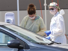 Testing is performed at the drive-thru COVID-19 Assessment Centre on Walford Road in Sudbury, Ont. on Tuesday May 26, 2020.