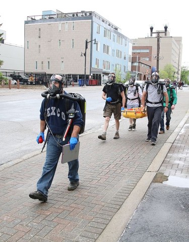 A Vale mine rescue team participates in a training session in downtown Sudbury on Friday May 29, 2020. The training session, which was put on by Ontario Mine Rescue, had team members walk around downtown so they could get used to using an oxygen breathing apparatus. Normally, mine rescue teams train at mine sites, but because of COVID-19 restrictions, training is being held at Ontario Mine Rescue stations, such as the one on Cedar Street. John Lappa/Sudbury Star/Postmedia Network