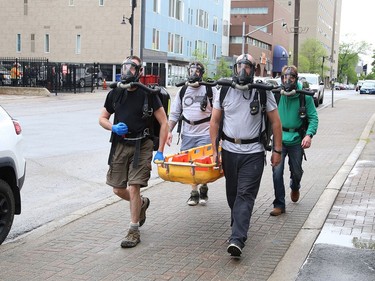 A Vale mine rescue team participates in a training session in downtown Sudbury on Friday May 29, 2020. The training session, which was put on by Ontario Mine Rescue, had team members walk around downtown so they could get used to using an oxygen breathing apparatus. Normally, mine rescue teams train at mine sites, but because of COVID-19 restrictions, training is being held at Ontario Mine Rescue stations, such as the one on Cedar Street. John Lappa/Sudbury Star/Postmedia Network