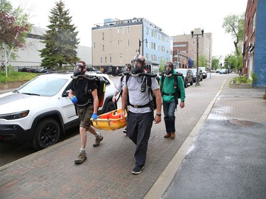 A Vale mine rescue team participates in a training session in downtown Sudbury on Friday May 29, 2020. The training session, which was put on by Ontario Mine Rescue, had team members walk around downtown so they could get used to using an oxygen breathing apparatus. Normally, mine rescue teams train at mine sites, but because of COVID-19 restrictions, training is being held at Ontario Mine Rescue stations, such as the one on Cedar Street. John Lappa/Sudbury Star/Postmedia Network