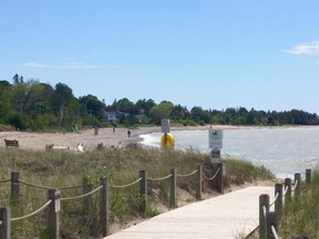 Just a few walkers braved the windy, waterfront at Southampton Beach May 31 that was re-opened to the public - as long as they follow physical distancing and group size rules.